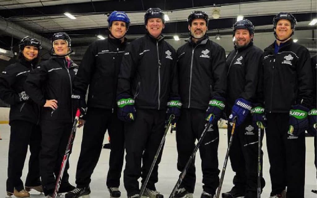 Private hockey lesson coaches pose for camera